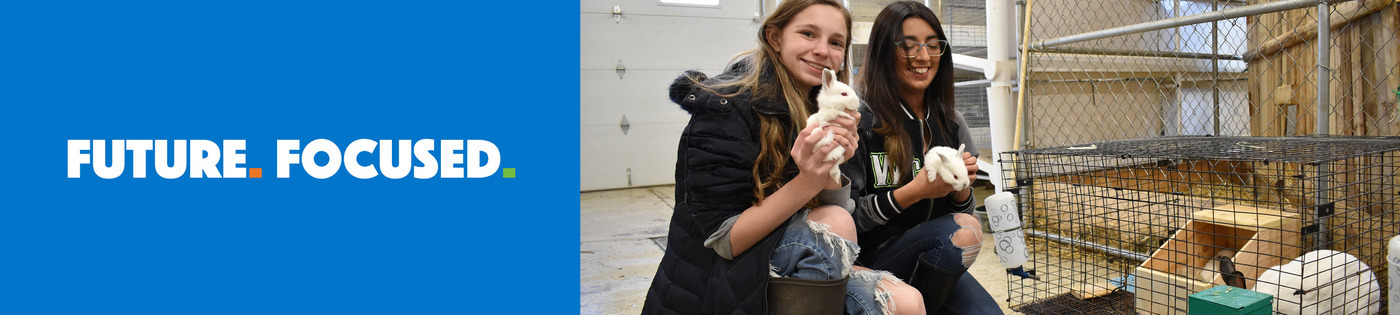 Environmental/Veterinary Sciences students caring for poultry in the barn