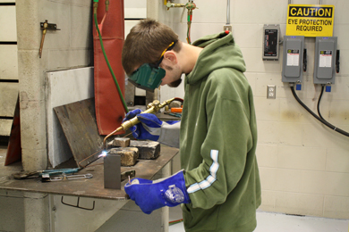Welding Technology student practicing a weld.