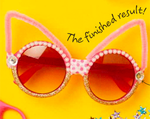 Sunglasses with rhinestones and pipe cleaners that form cat ears.