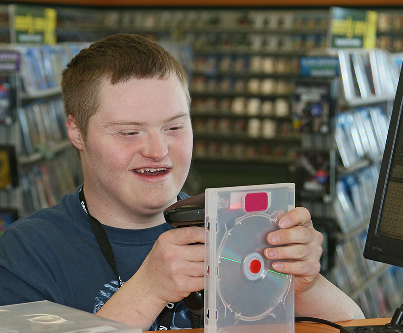 Man at Video Store Working