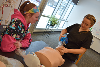 Allied Health students demonstrate infant CPR
