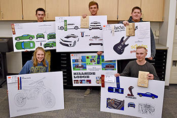 CAD students holding their projects for competition.