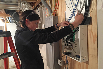 Photo of Electrical/Computer Technologies student working on residential wiring.