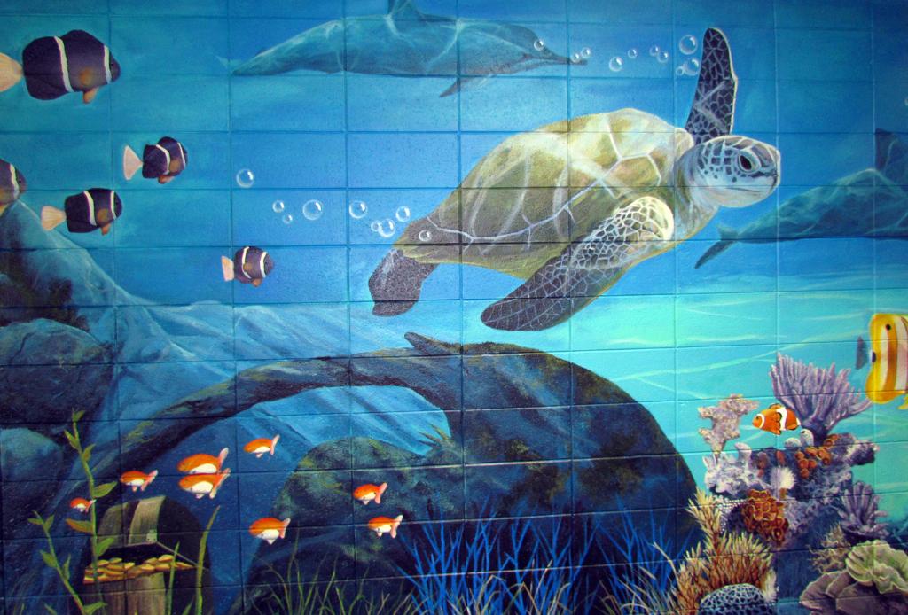 Ocean scene painted on sensory hallway wall in school